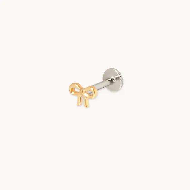 Astrid & Miyu Bow piercing titane doré nœud