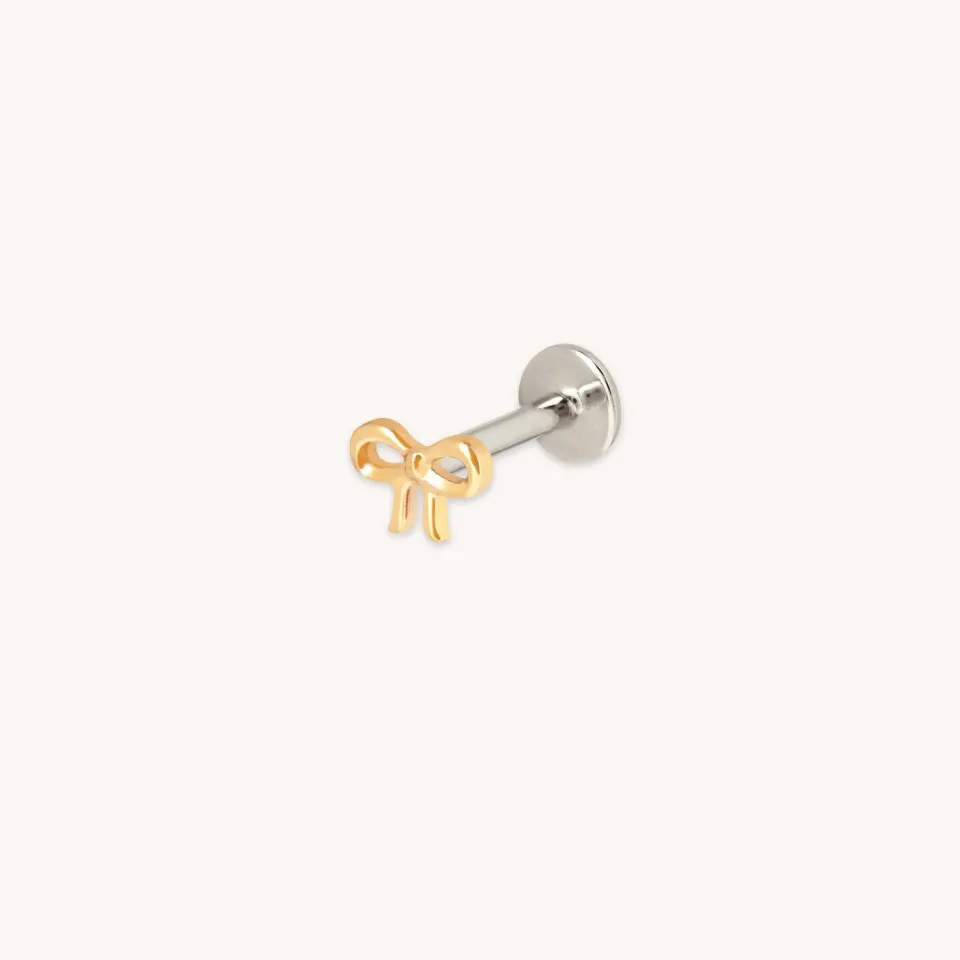 Astrid & Miyu Bow piercing titane doré nœud