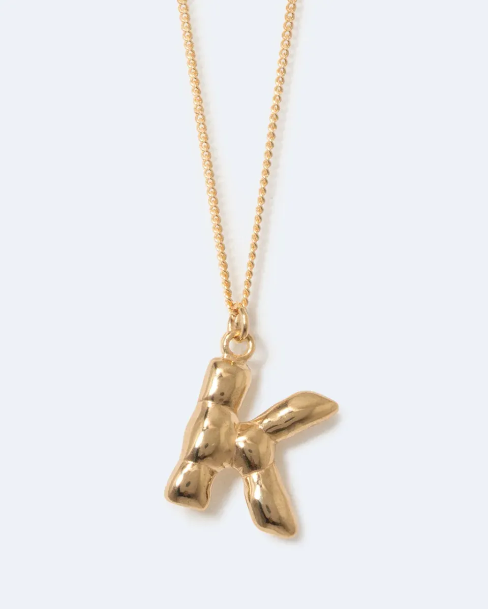 Completedworks Classicworks K collier pendentif doré lettre K
