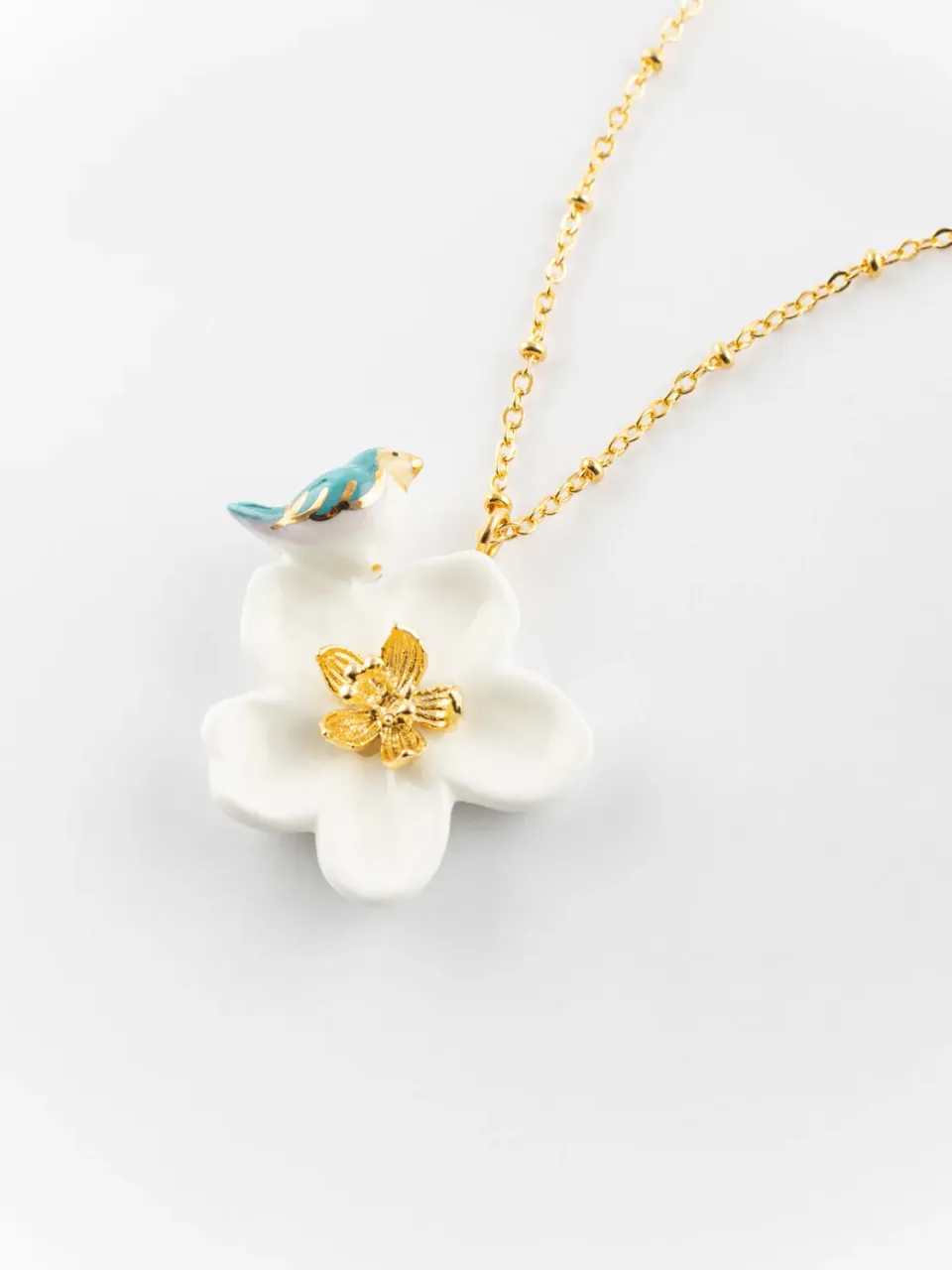 Nach Bijoux fleur de poirier et oiseau collier porcelaine