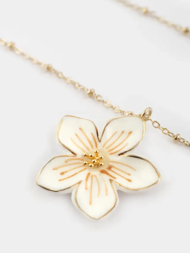 Nach Bijoux Collier fleur blanche porcelaine dorée