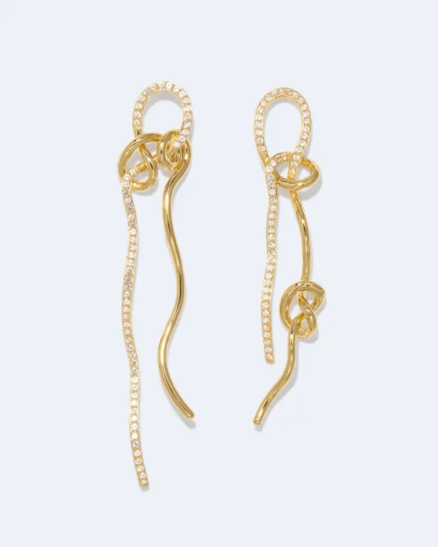 Completedworks Coil Not Even The Mathematician Can Create Things At Will boucles d’oreilles topaze blanche