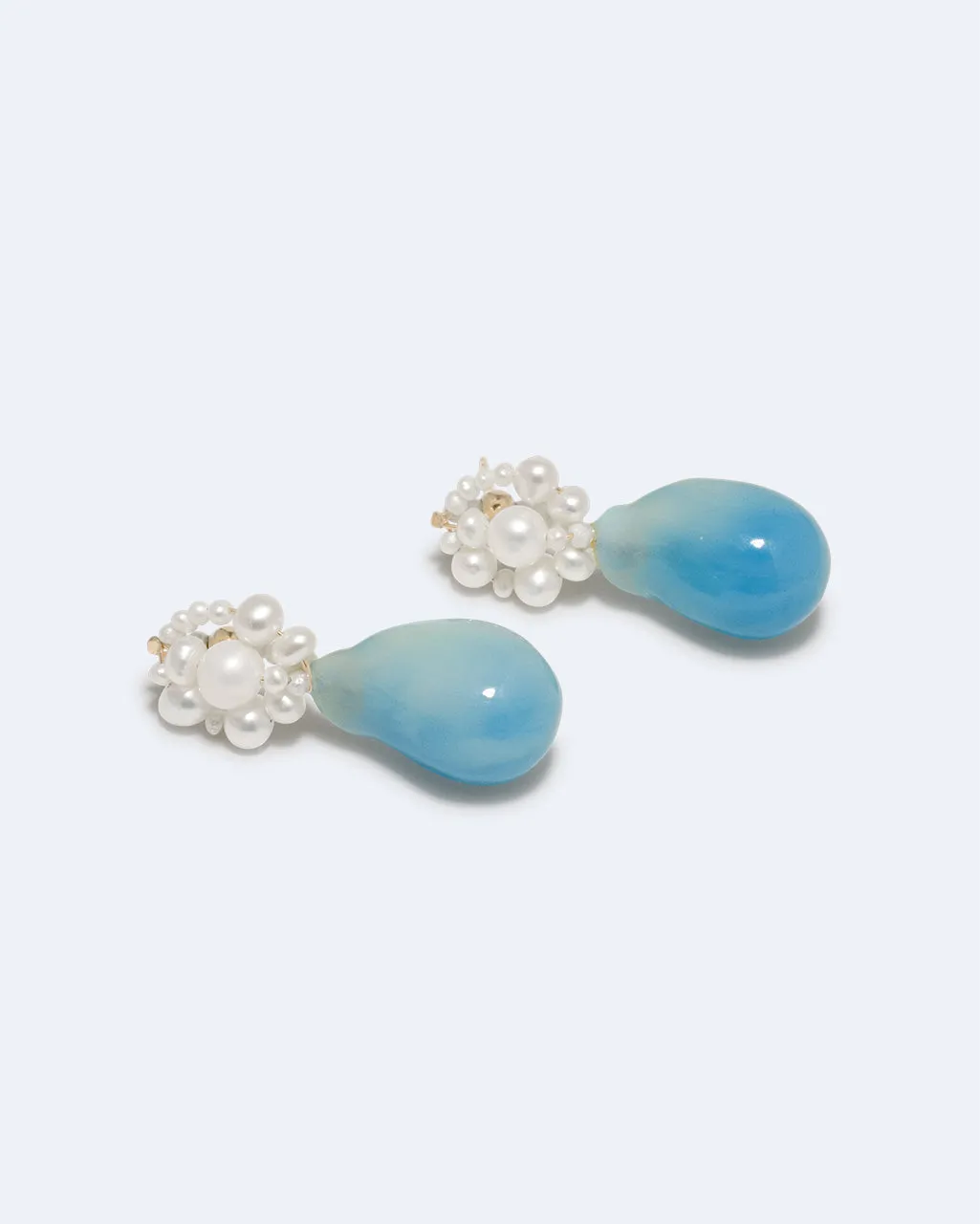 Completedworks Tra-la-la boucles perle résine bleue