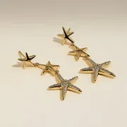 Astrid & Miyu Starfish boucles pendantes dorées