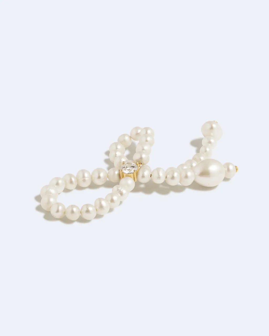 Completedworks The Tender Grip bague perle zircone dorée