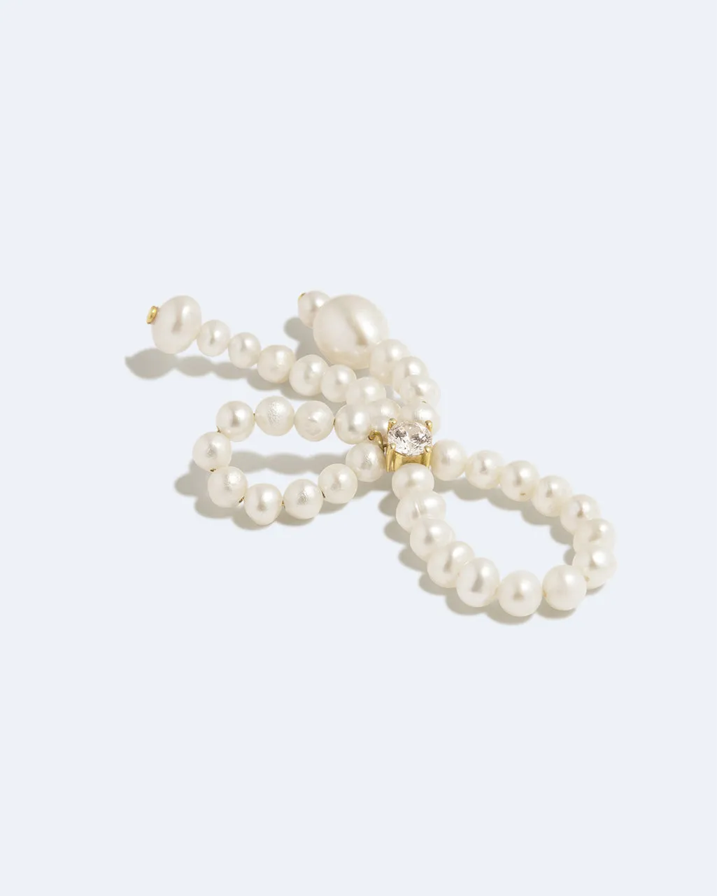 Completedworks The Tender Grip bague perle zircone dorée