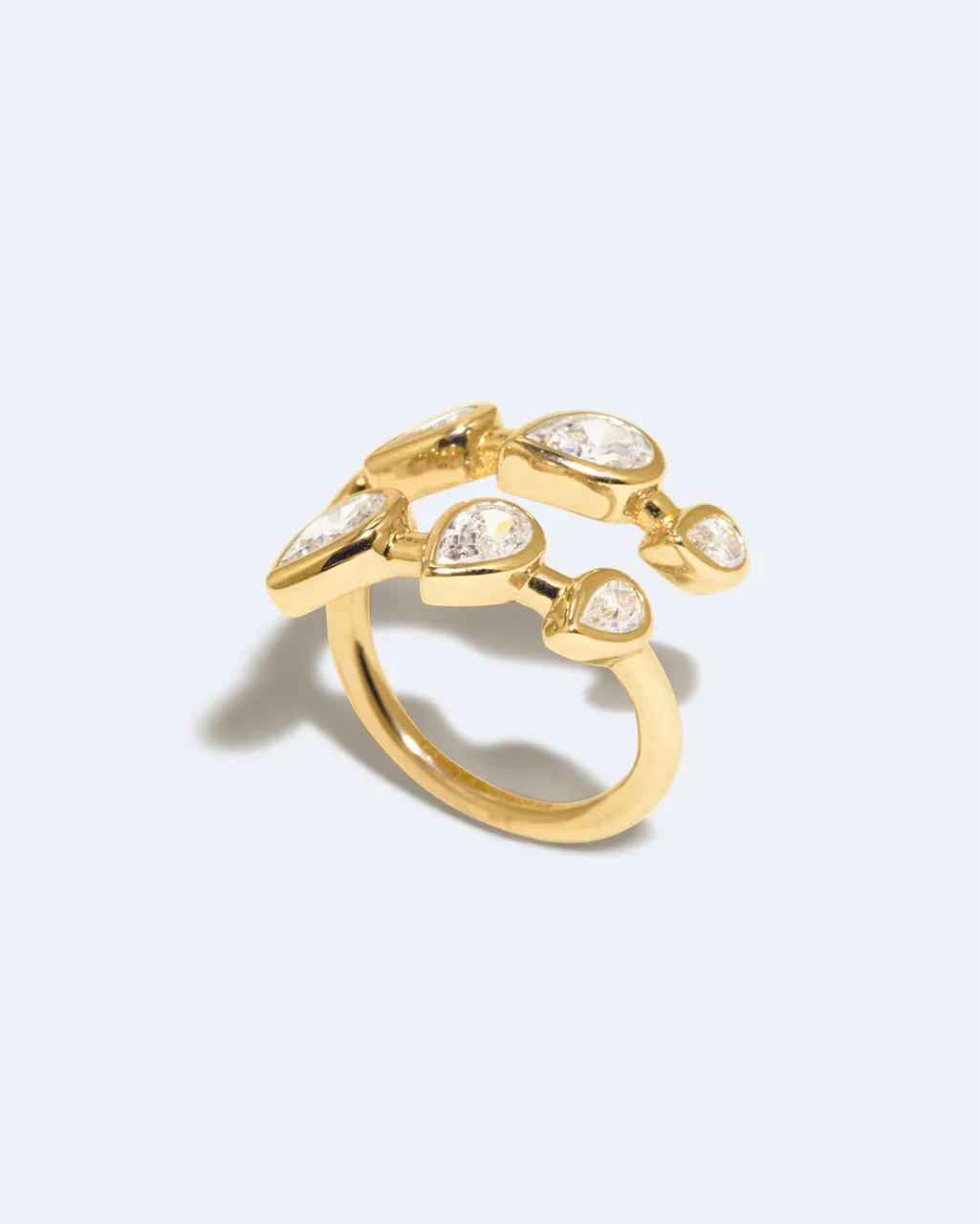 Completedworks Arc bague ouverte zirconia dorée