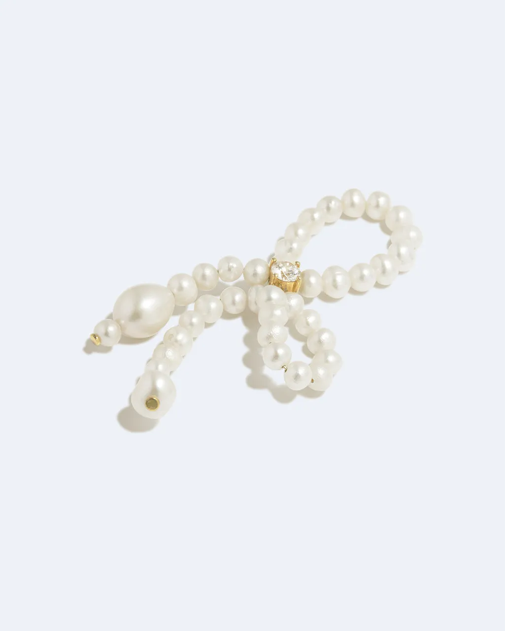 Completedworks The Tender Grip bague perle zircone dorée