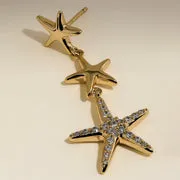 Astrid & Miyu Starfish boucles pendantes dorées