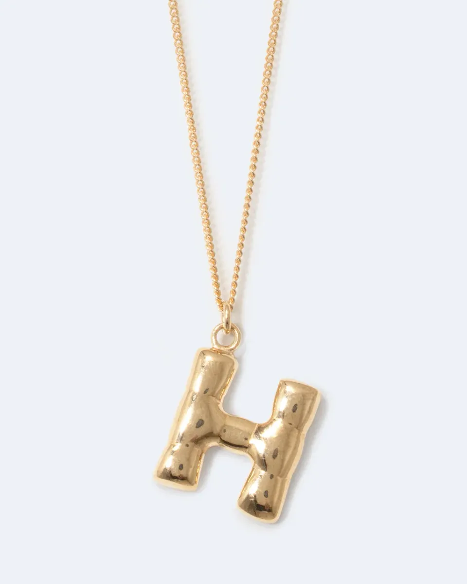 Completedworks Classicworks H collier lettre plaqué or