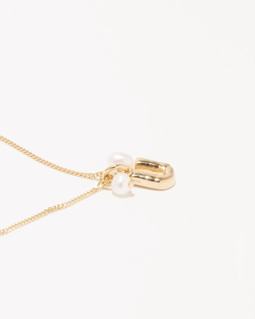 Completedworks Classicworks U bracelet perle vermeil or