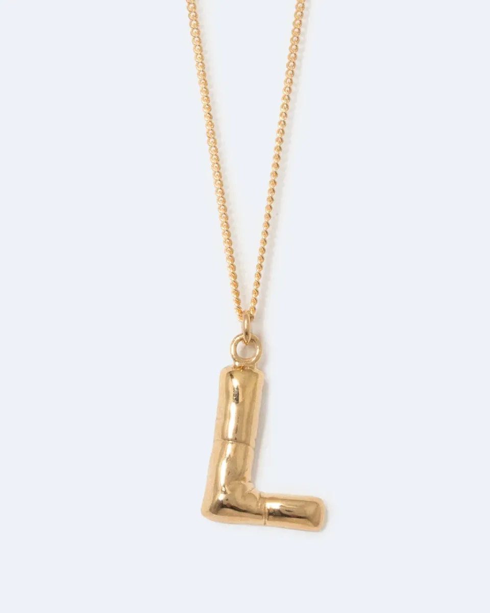 Completedworks Classicworks L collier plaqué or initiale dorée