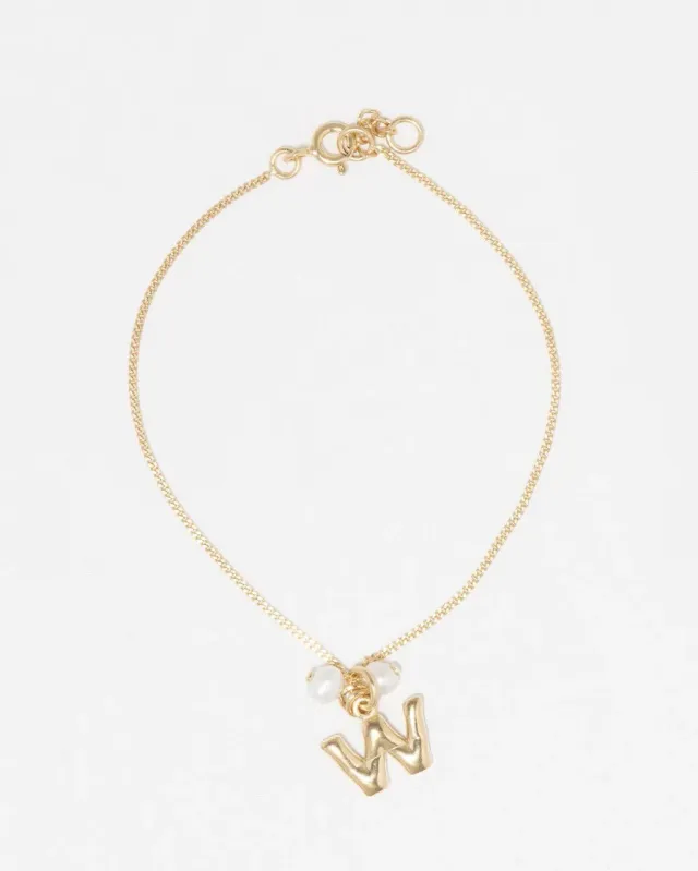 Completedworks Classicworks W bracelet perle vermeil or