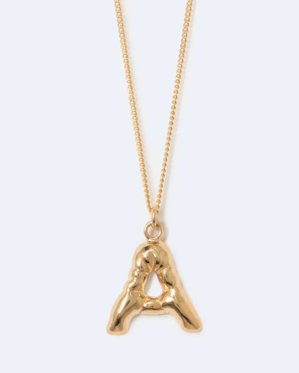 Completedworks Classicworks A collier lettre plaqué or