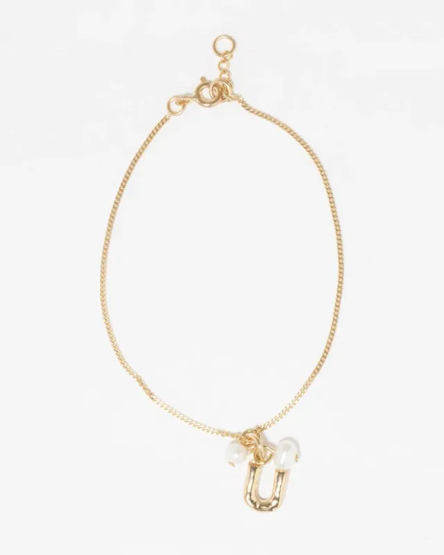 Completedworks Classicworks U bracelet perle vermeil or
