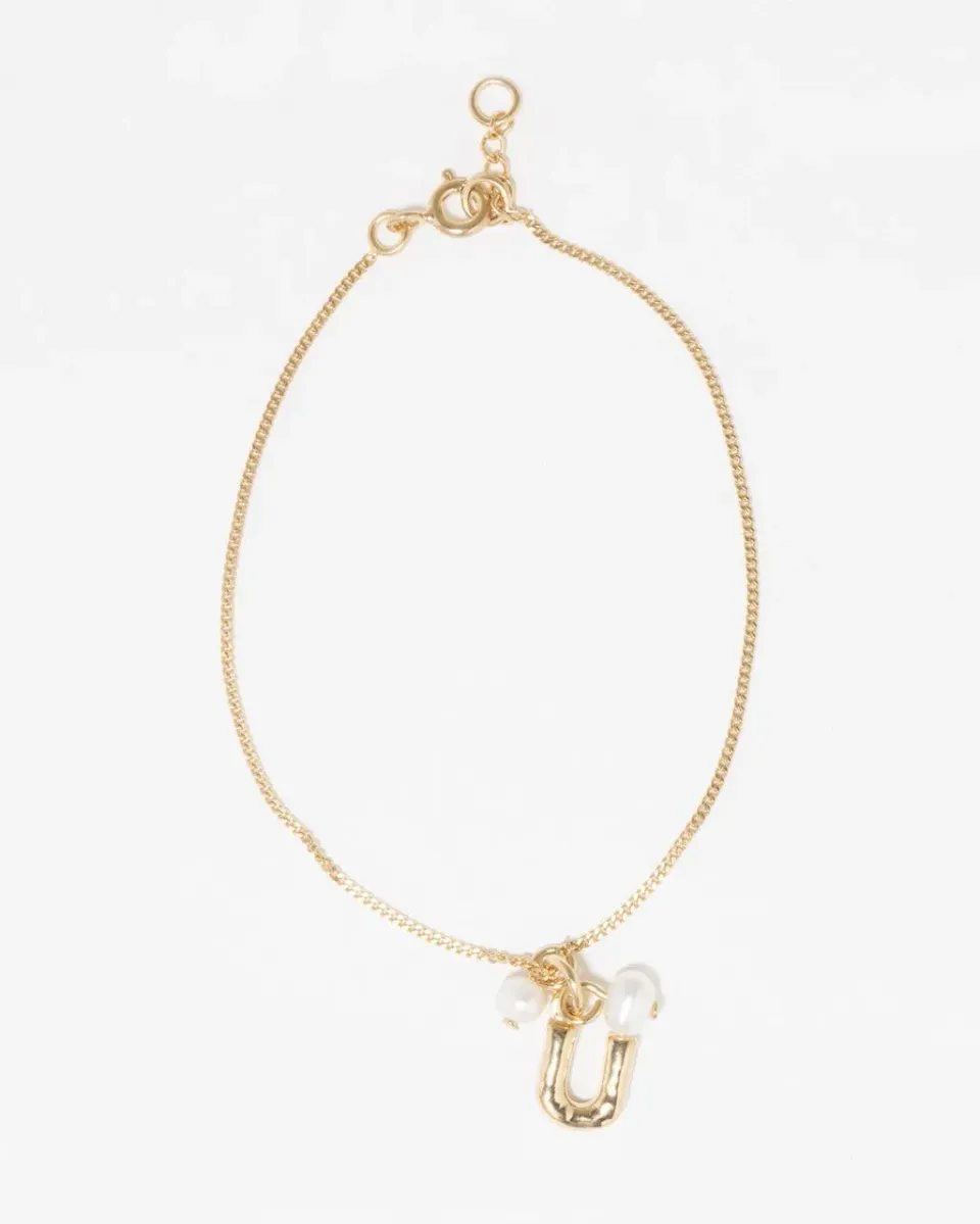 Completedworks Classicworks U bracelet perle vermeil or