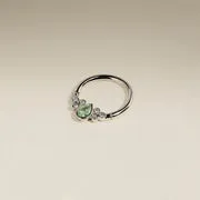 Astrid & Miyu Diamond Green Sapphire Pear Daith Hoop piercing