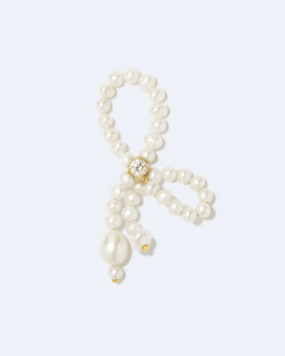 Completedworks The Tender Grip bague perle zircone dorée