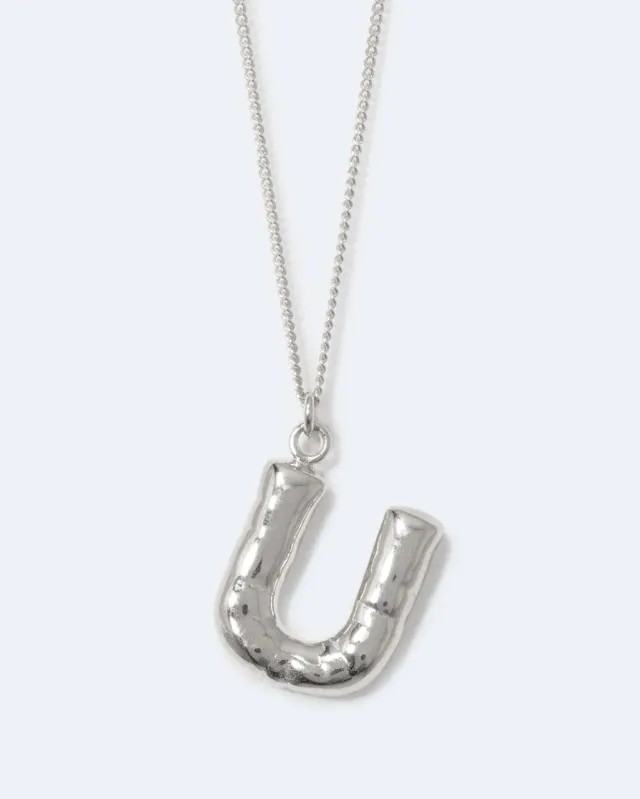 Completedworks Classicworks U collier argent recyclé initiale