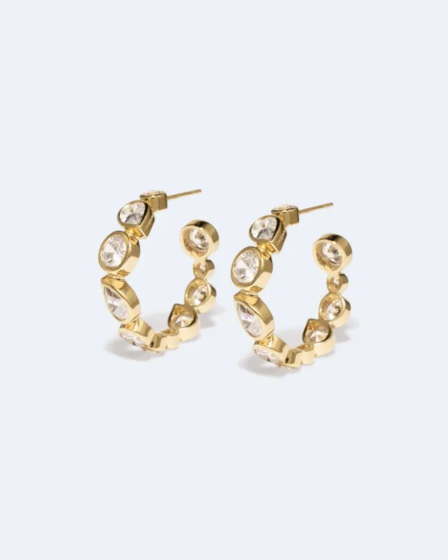 Completedworks A Few Good Anti-Heroes boucles zirconia doré