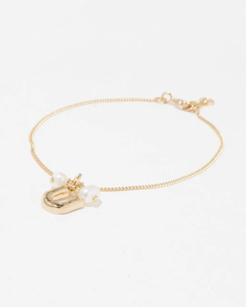 Completedworks Classicworks U bracelet perle vermeil or